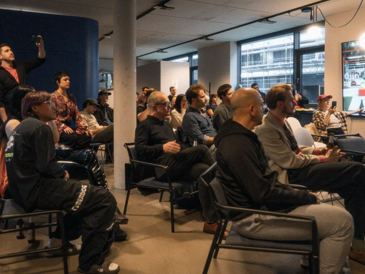 A full room of filmmakers follows a presentation